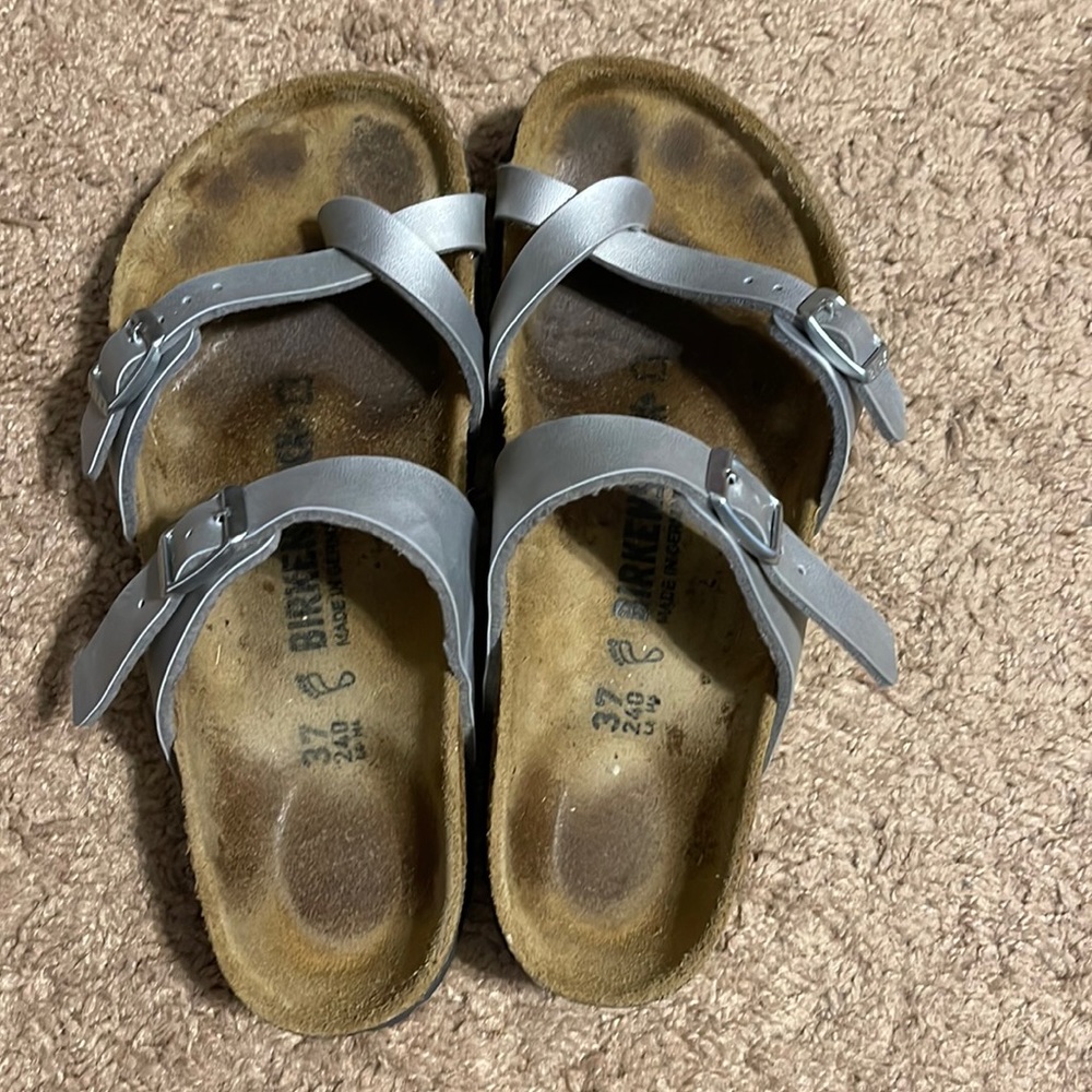 Birkenstocks, good condition. Lots of wear left.